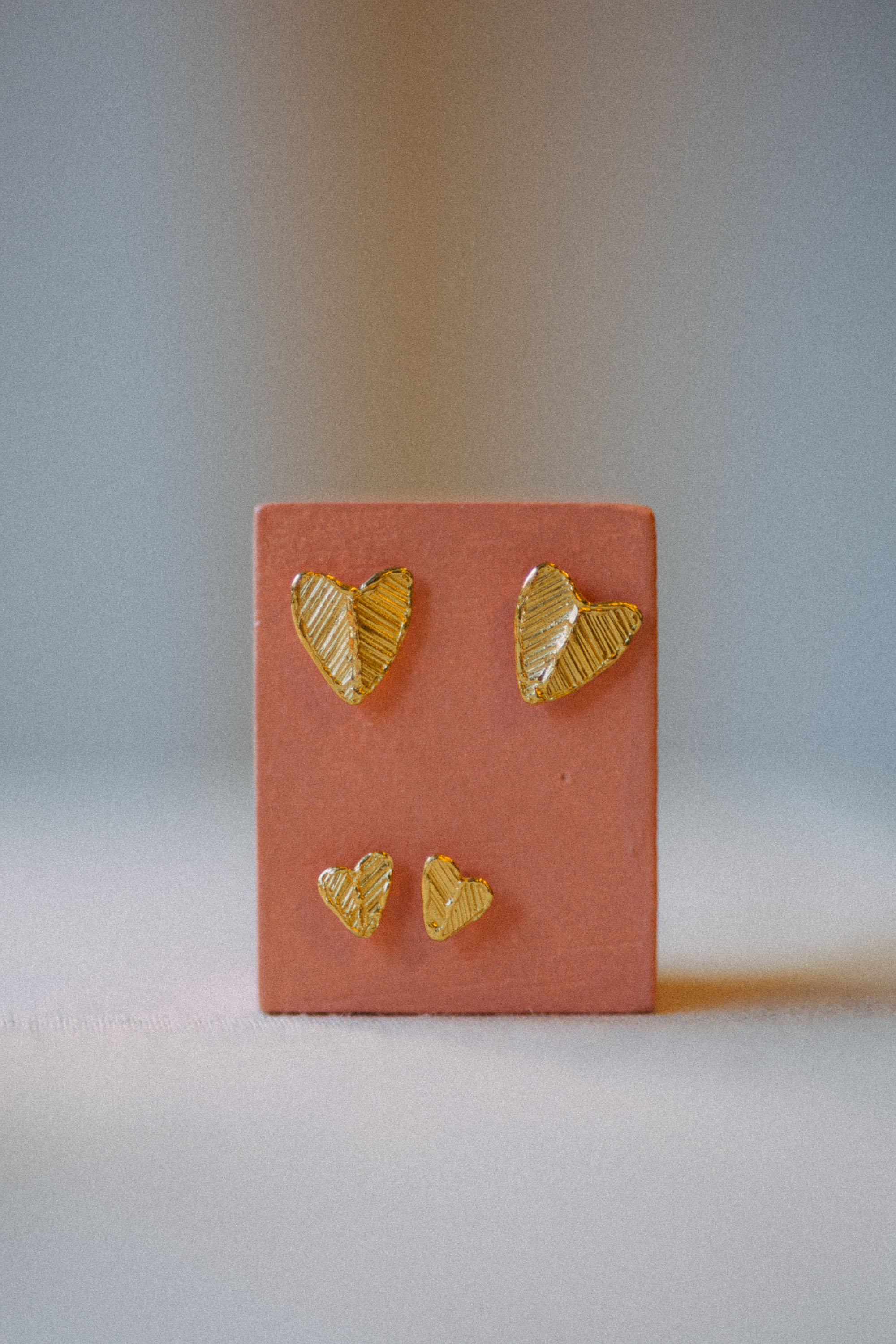 HEART studs in Medium