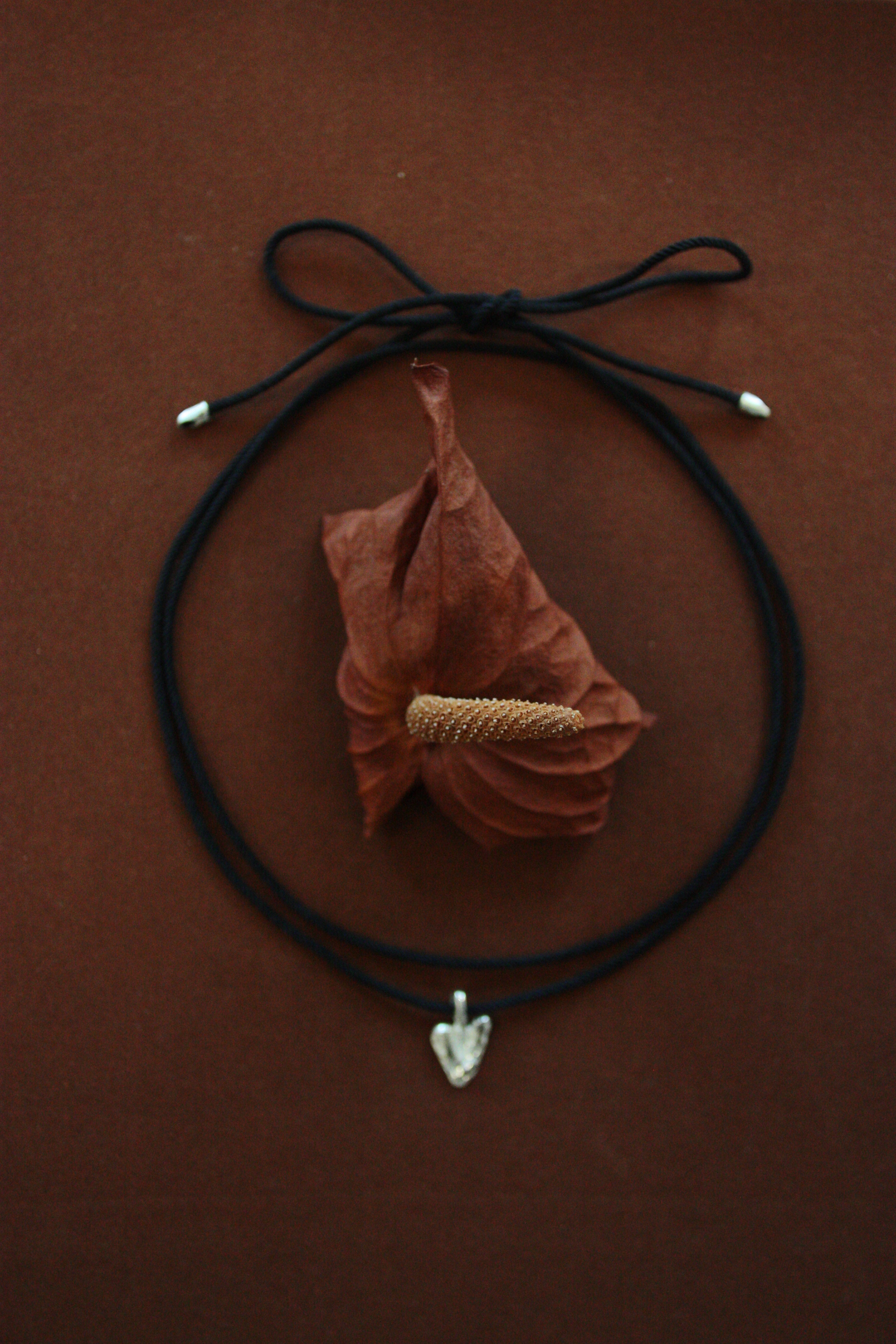 Molten Heart on black cord.