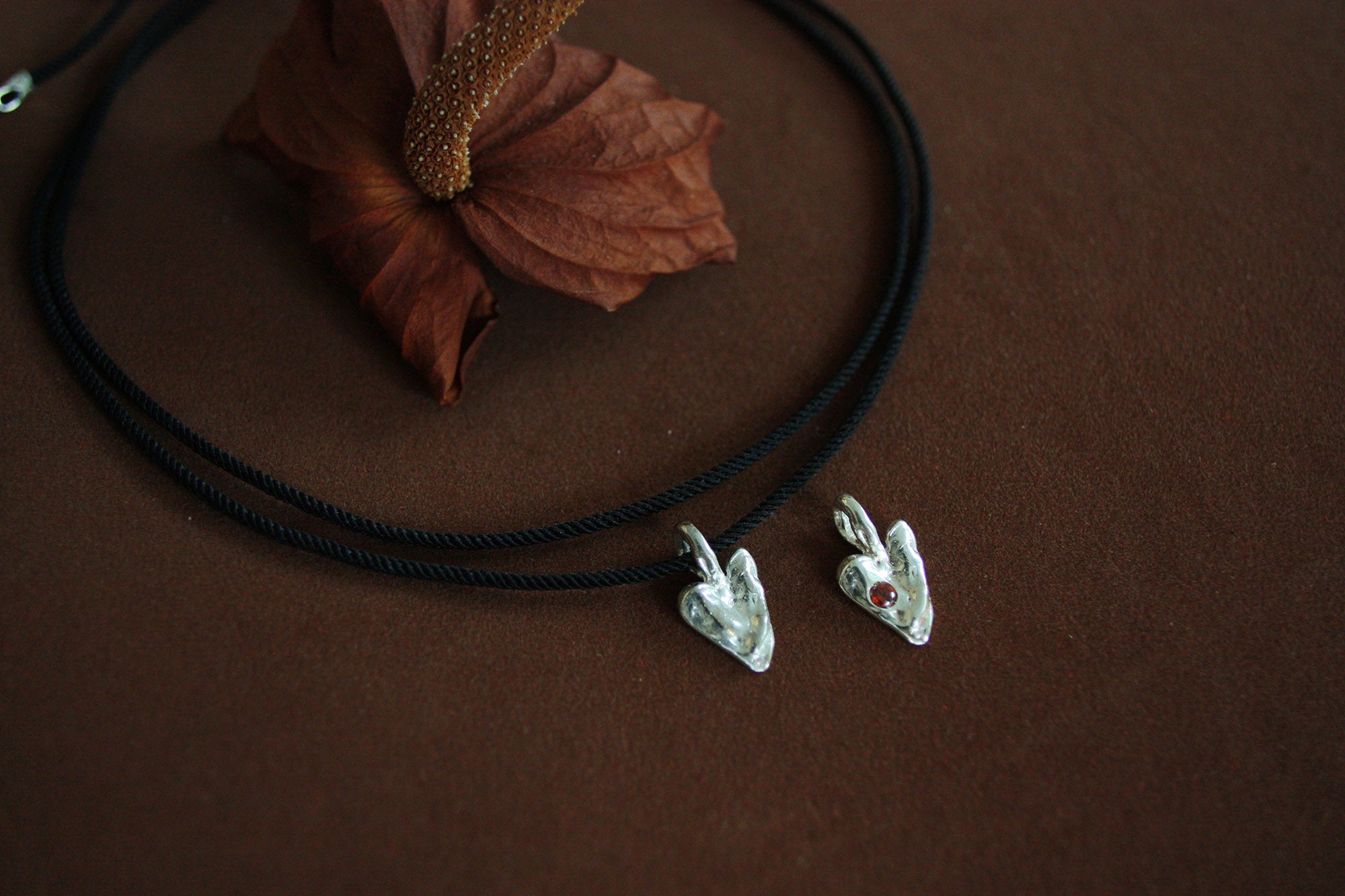 Molten Heart on black cord.